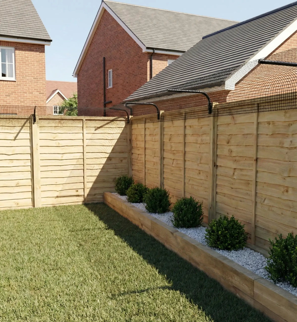 Cat fence barrier installed on a timber garden fence